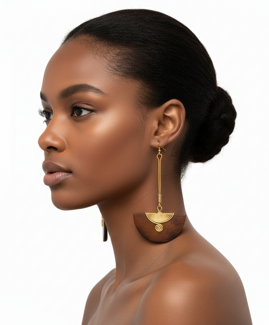 Woman wearing gold earrings on a white background
