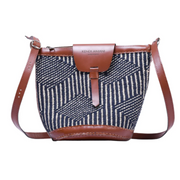 A black and white wool woven bag with leather accents on a white background.