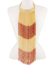  A Maasai long beaded statement necklace with a brass collar, showcasing the necklace's vibrant colors and intricate design.