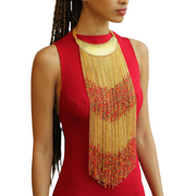 A woman wearing a Maasai long beaded statement necklace with a brass collar, showcasing the necklace's vibrant colors and intricate design.