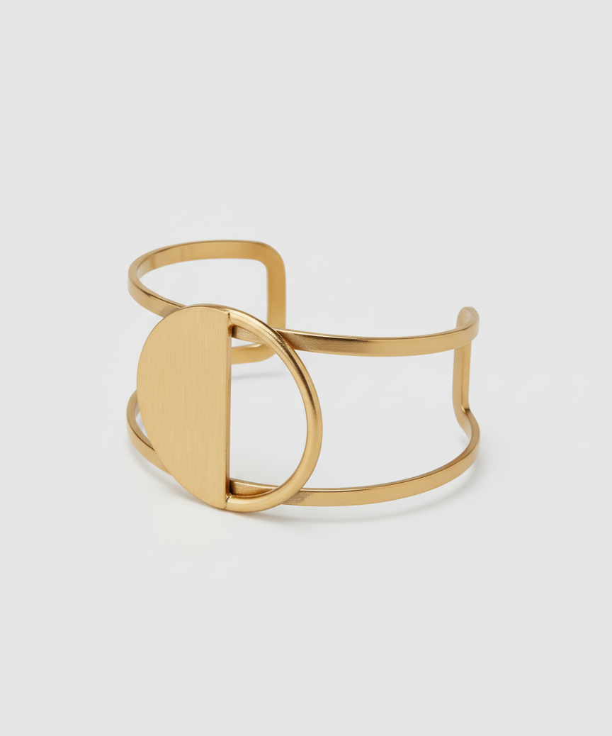Gold cuff on a light gray background