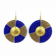 Pair of earrings with blue and gold circular design on a white background