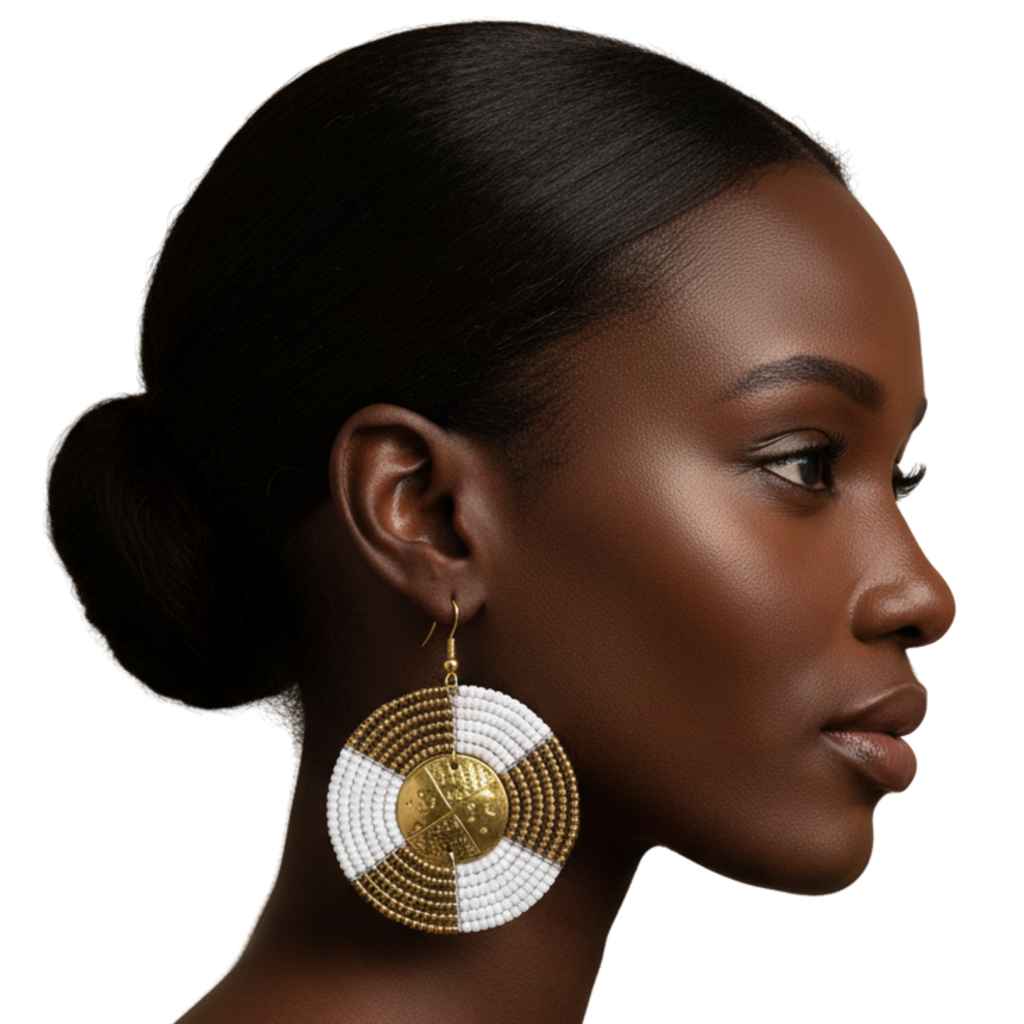 Woman wearing large beaded earrings on a white background