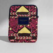 Colorful patterned pouch with 'Kendi Amani' branding on a gray background