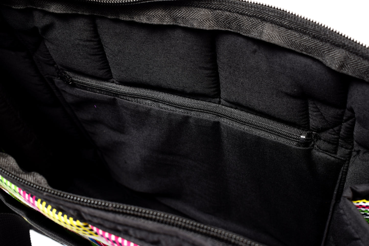 A close-up view of the inside of a tote bag. Zoom in on the inner zipper.