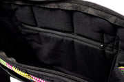 A close-up view of the inside of a tote bag. Zoom in on the inner zipper.