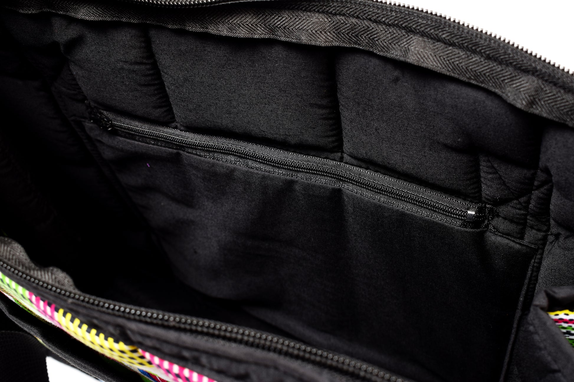 A close-up view of the inside of a tote bag. Zoom in on the inner zipper.