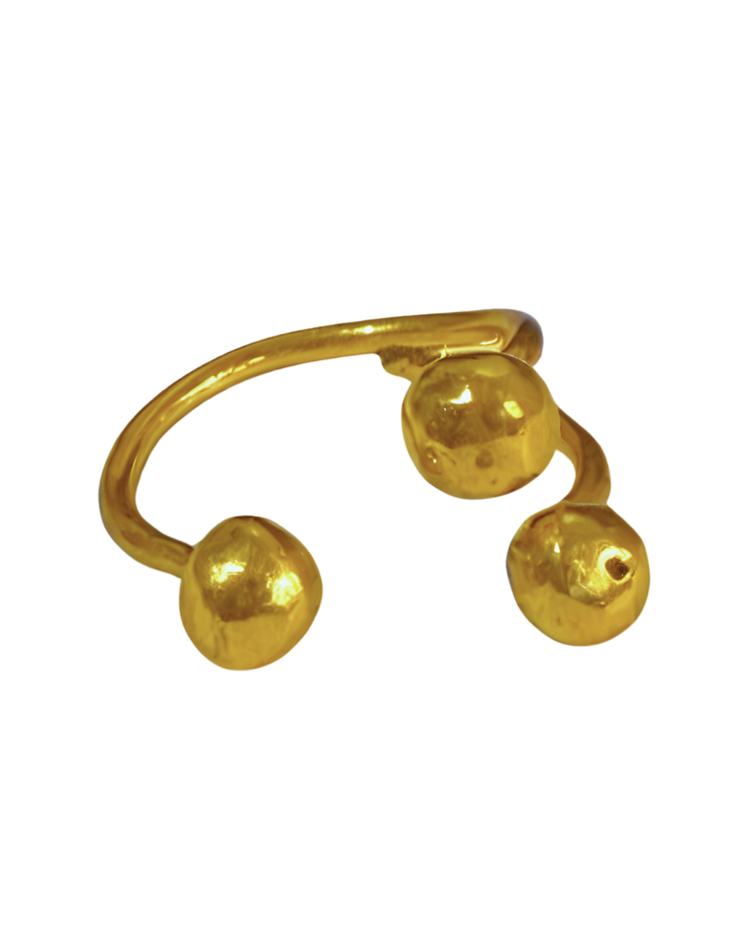 Gold nose ring with three spherical ends on a white background