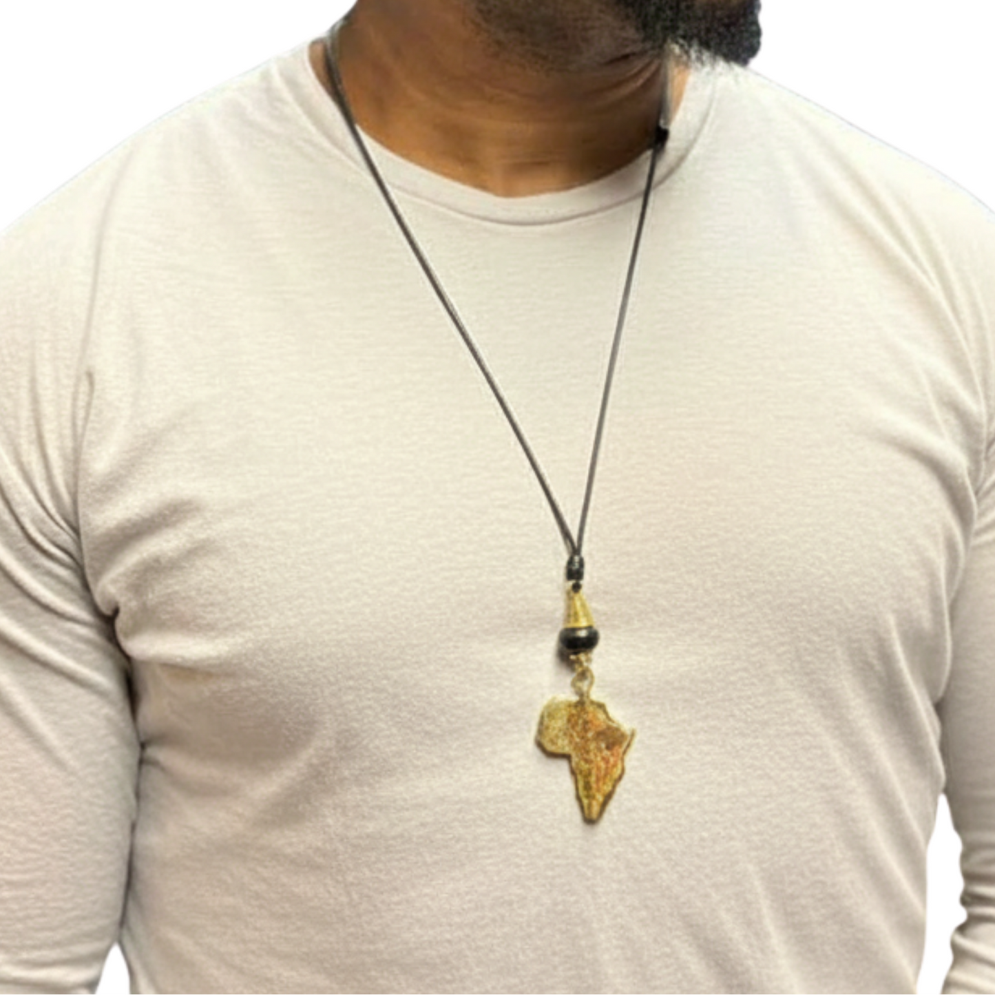 Man wearing a necklace with an African continent pendant on a white background